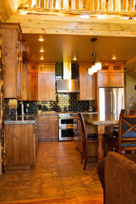 Shaker style kitchen with a rustic contemporary black subway tile backsplash in Elk Ridge located in Southern Ut